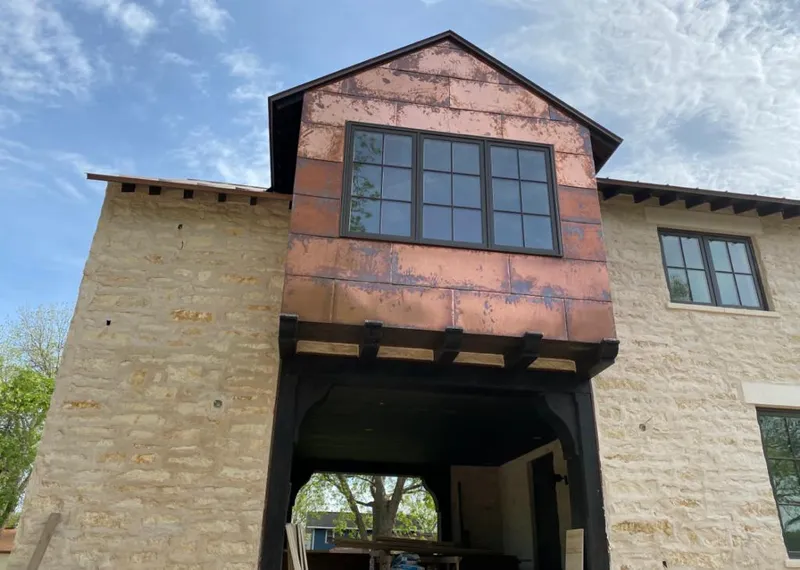 Copper metal panel facade on a stone building for Metal Roof Coating in Albemarle